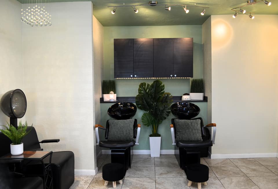 Native Soul Salon shampoo station with sage green accent wall